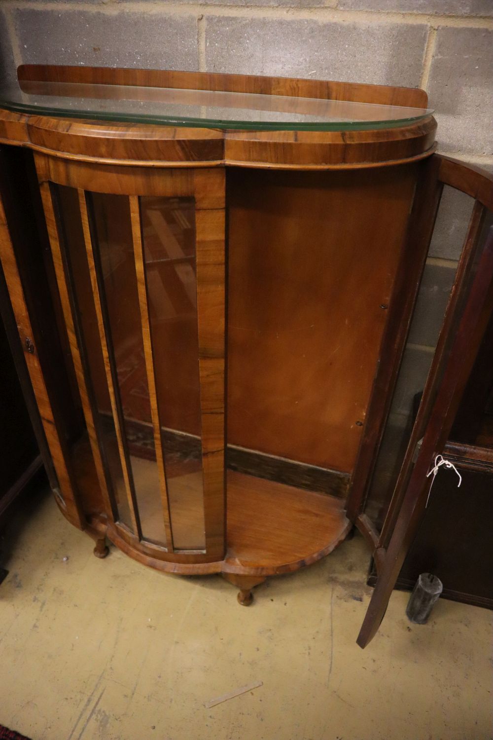 A walnut bowfront display cabinet, width 92cm depth 40cm height 124cm